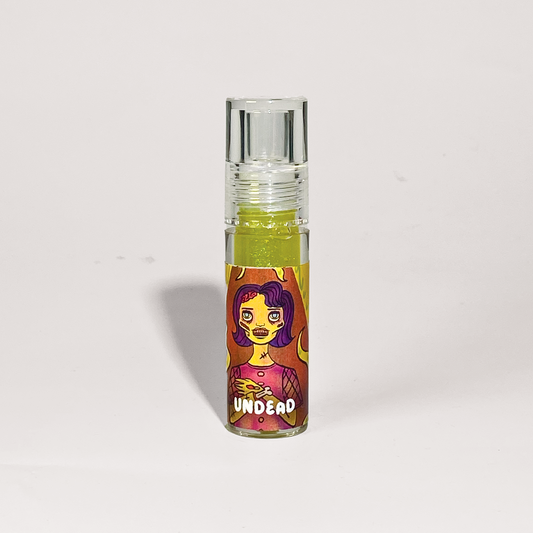 Small glass bottle with colorful label featuring a character on a light gray background